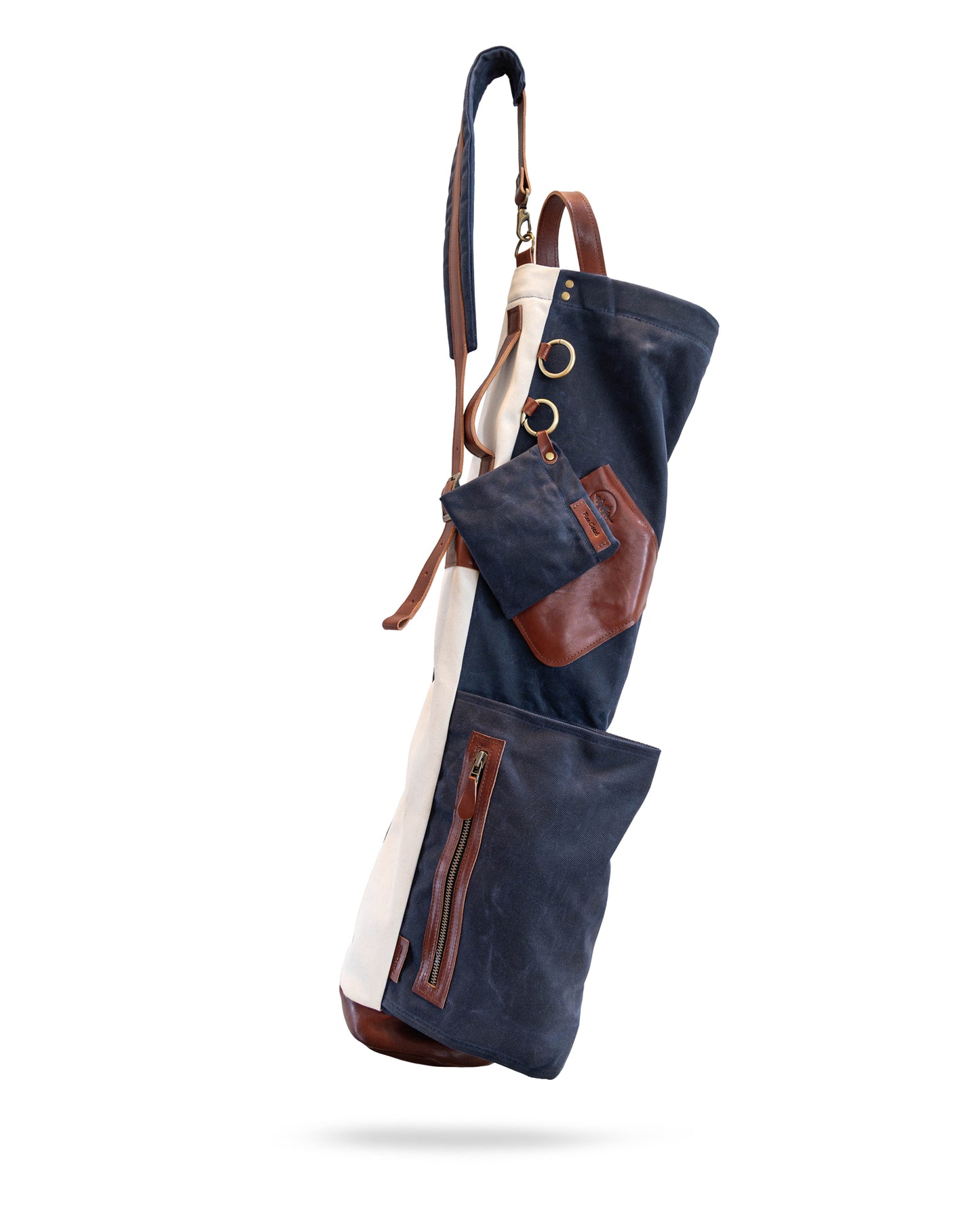The Whitecap Sunday golf bag in deep navy waxed canvas with a white canvas backbone, front view